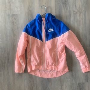 Women’s small blue and pink Nike windbreaker.